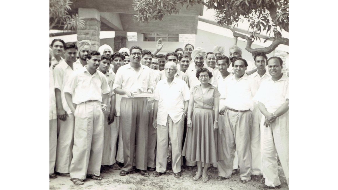 Eulie Chowdhury with Pierre Jeanneret and colleagues of the Chandigarh Capital Project, 1960. Photograph licensed under CC BY‑SA 4.0 via <a href="https://commons.wikimedia.org/wiki/File:Q_008.jpg" target="new">Wikimedia</a>.