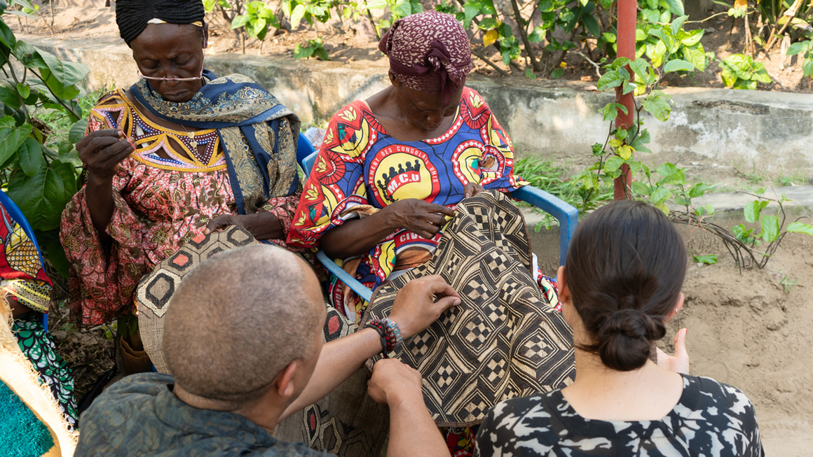 Stephen Burks and Malika Leiper at the Kilubukila Atelier in Kinshasa with artist Adele Mbomatchiele Bope, 2025. Courtesy of Stephen Burks Man Made.