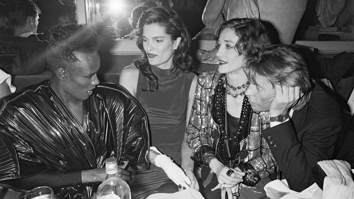 Grace Jones, Helmut Berger, and guests at Le Palace Fifth Anniversary party, 1983. Photograph by Bertrand Rindoff Petroff via Getty Images.
